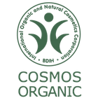 COSMOS Organic-logotyp i grönt och vitt mot svart bakgrund.